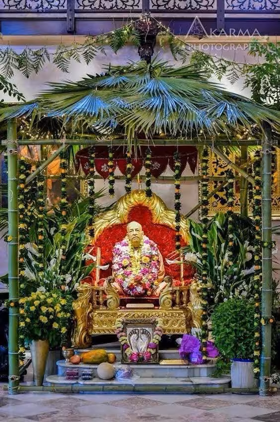 Prabhupada in bamboo mandap with tropical decorations