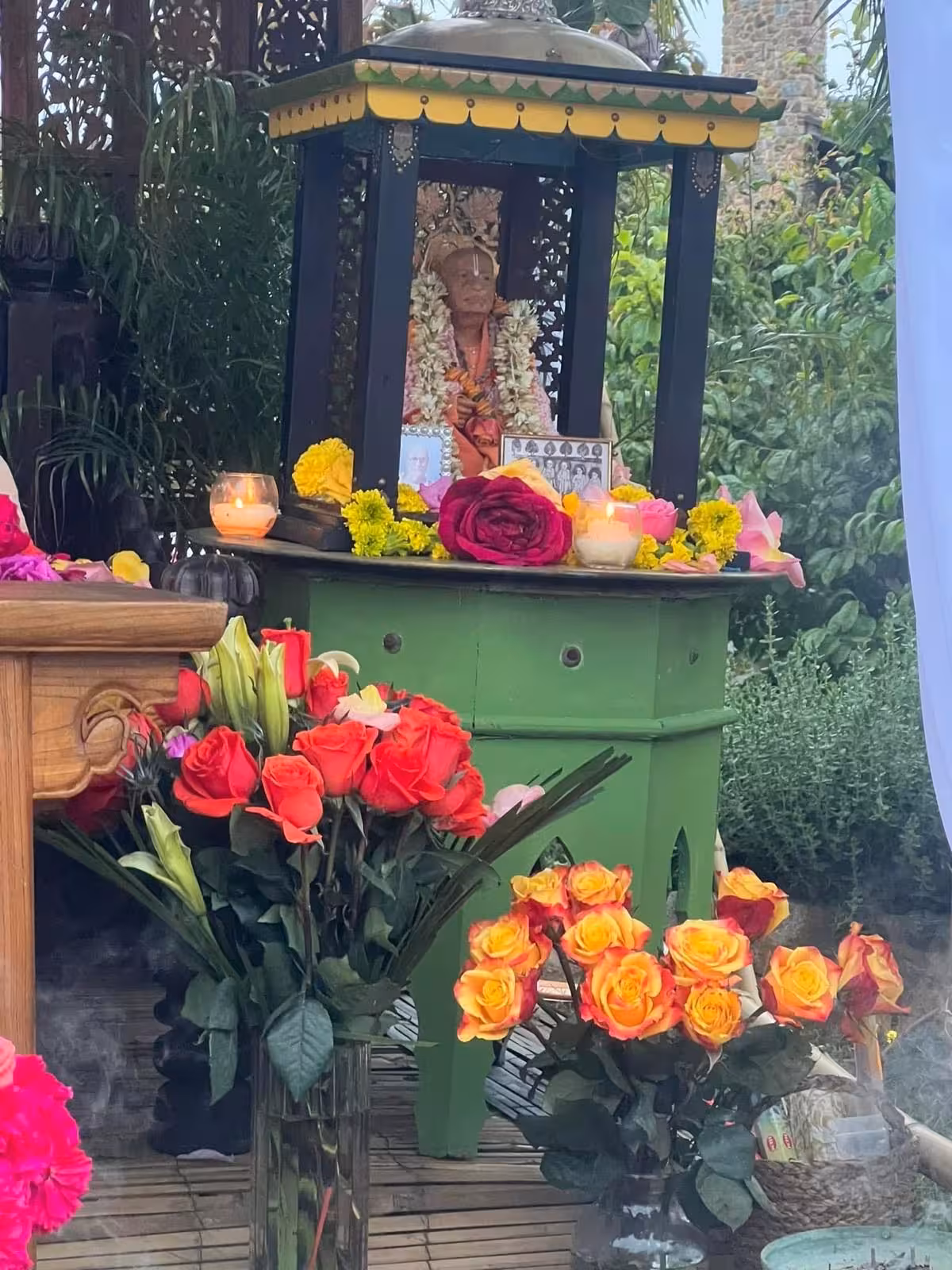 Green shrine decorated with roses